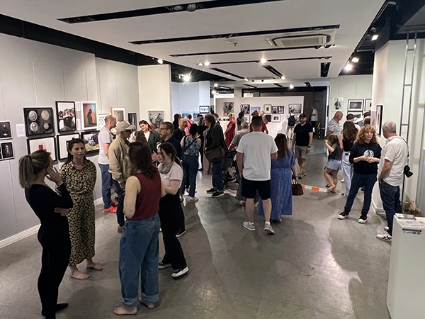 Public audience engaging with contemporary photographic works at Chester Photo Festival.