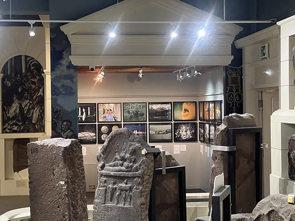 Exhibition display featuring international photography at the Grosvenor Museum during the 2025 festival.