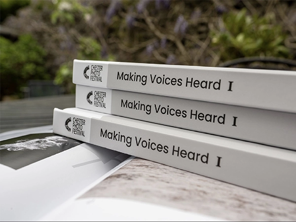 Side view showing the high-quality hardback spine of the Chester Photo Festival exhibition book.